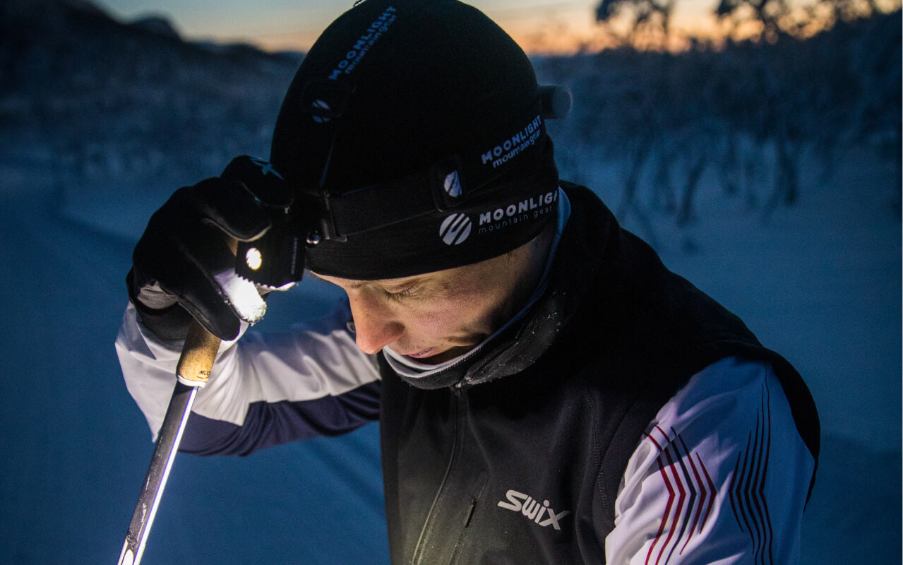 Cross country skier wearing moonlight headlamp