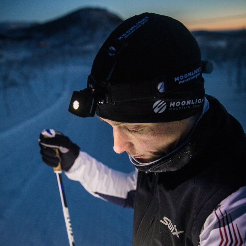 Cross country skier being comfortable wearing Moonlight Headlamp
